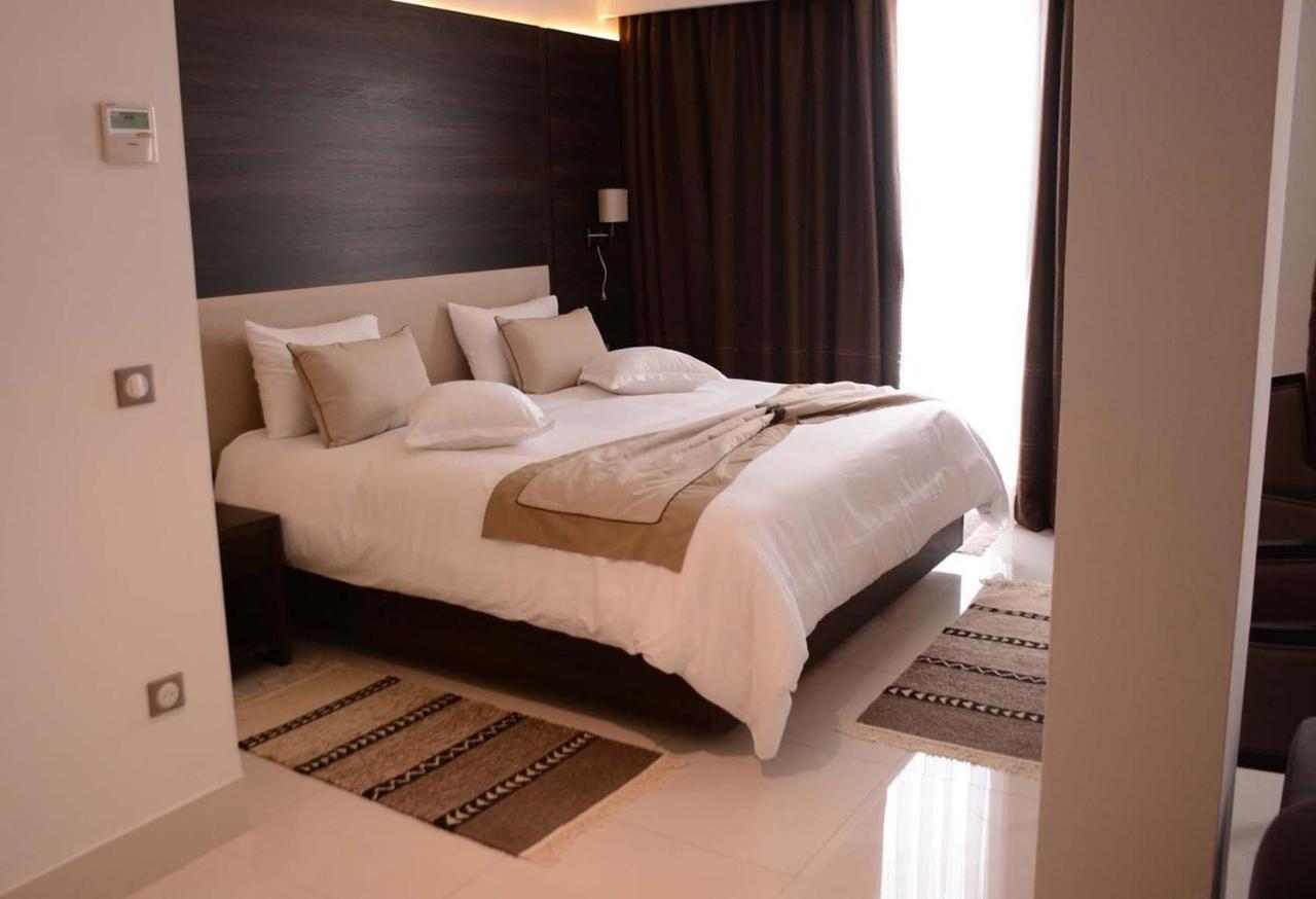 Radisson Hotel Szfaksz Kültér fotó A bedroom