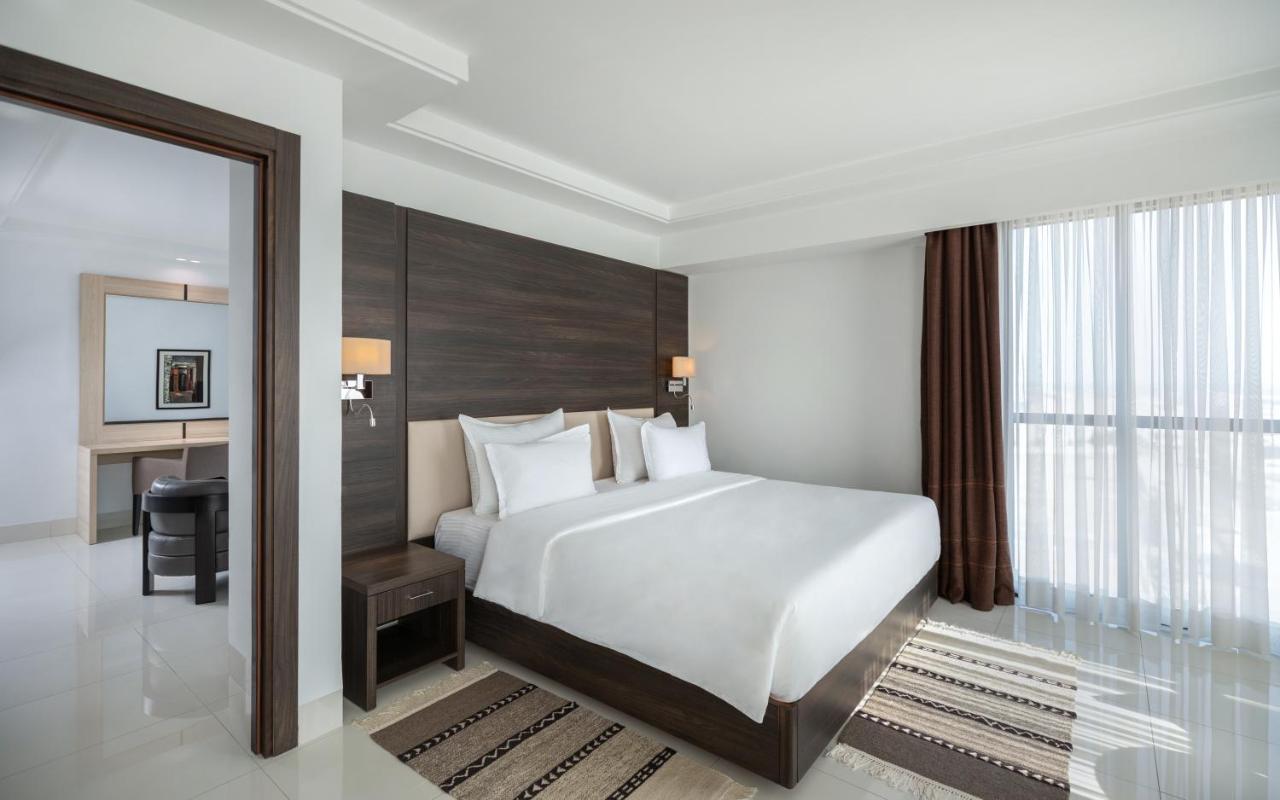 Radisson Hotel Szfaksz Kültér fotó A bedroom at the hotel