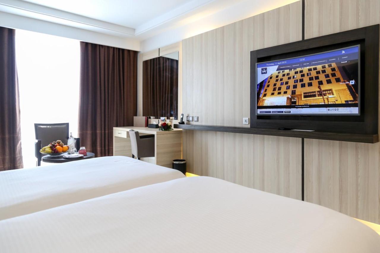 Radisson Hotel Szfaksz Kültér fotó A room at Novotel Saigon Centre